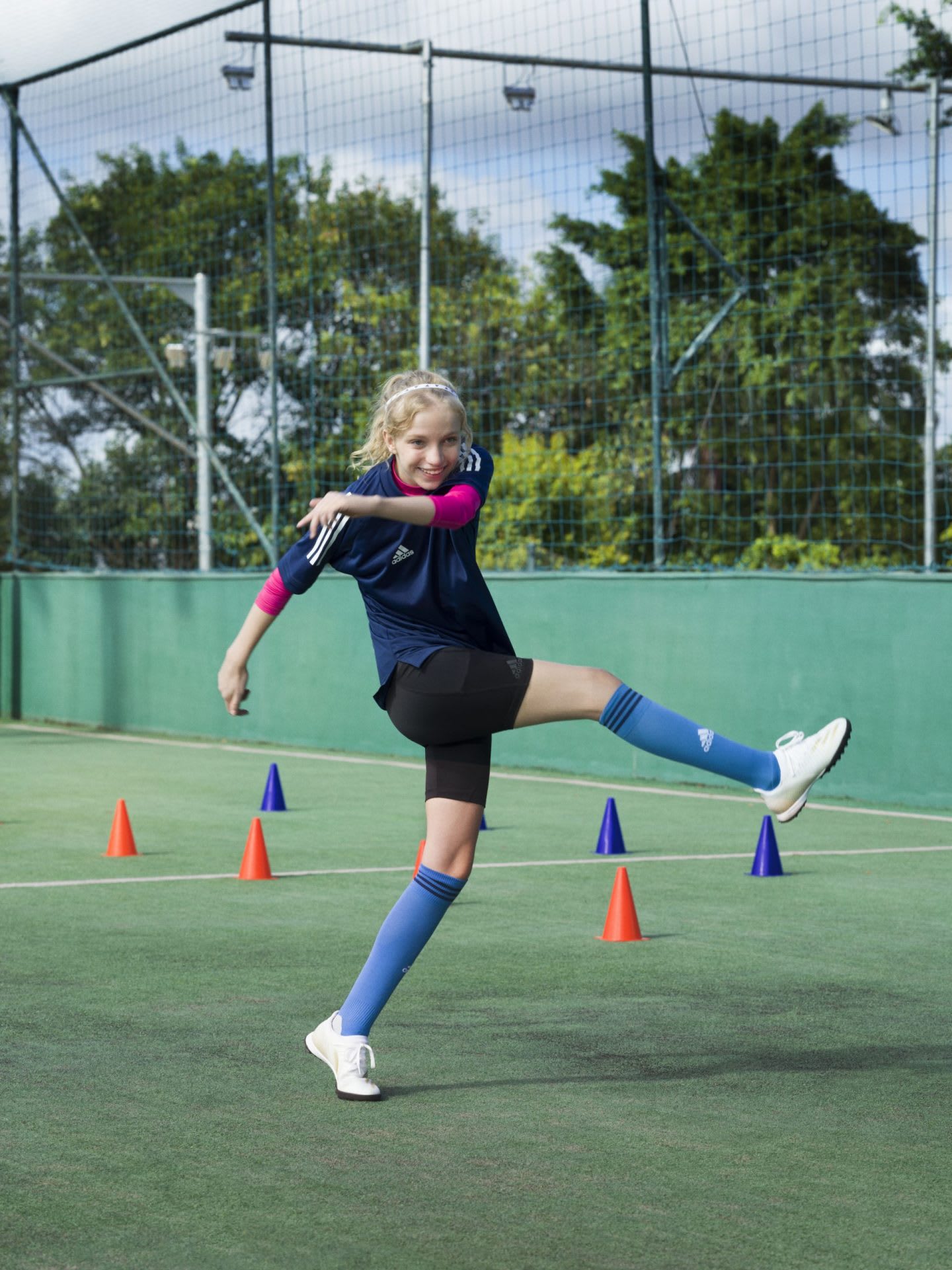 Young female footballer takes part in a training session.