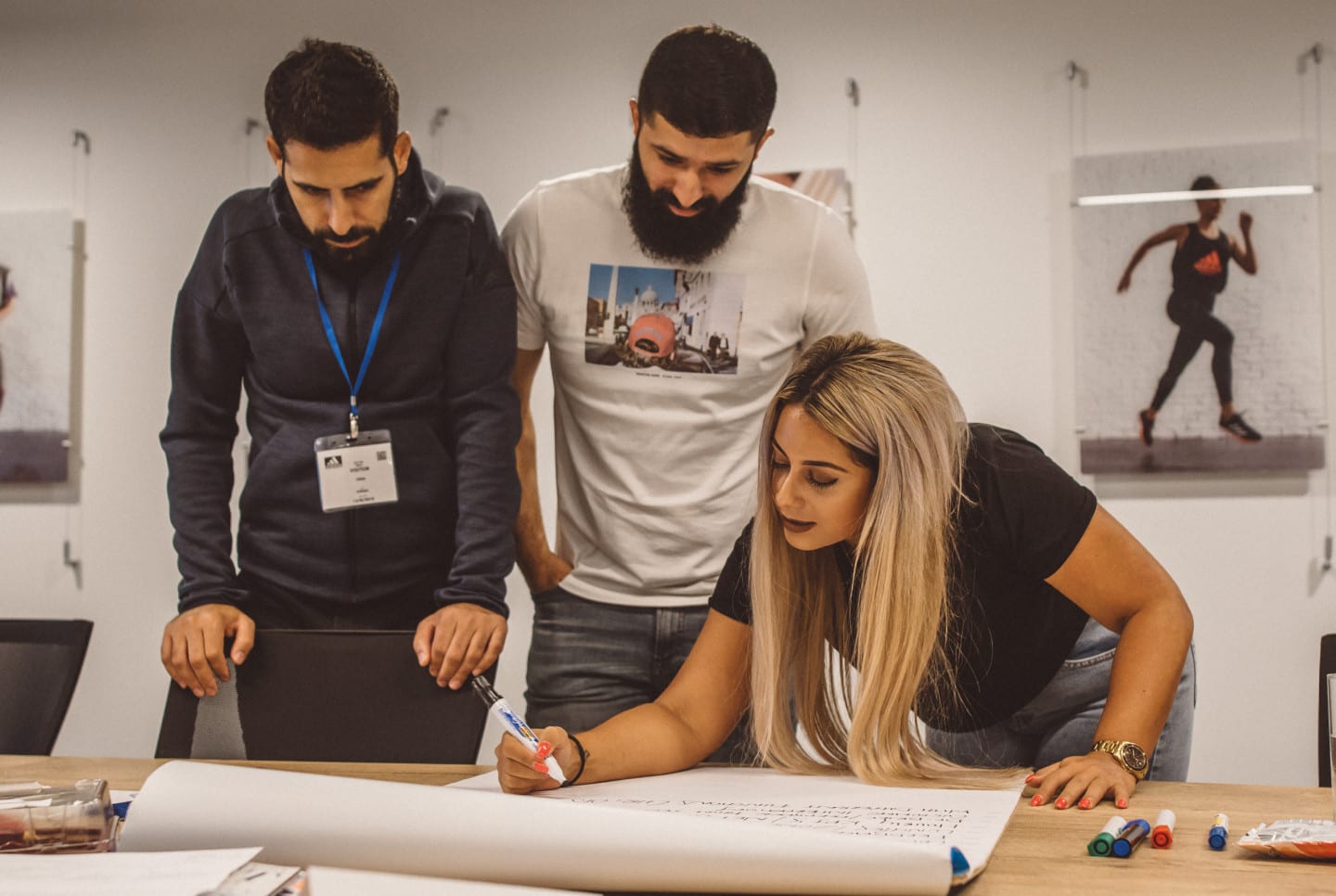 Team of adidas workers working together to create new designs