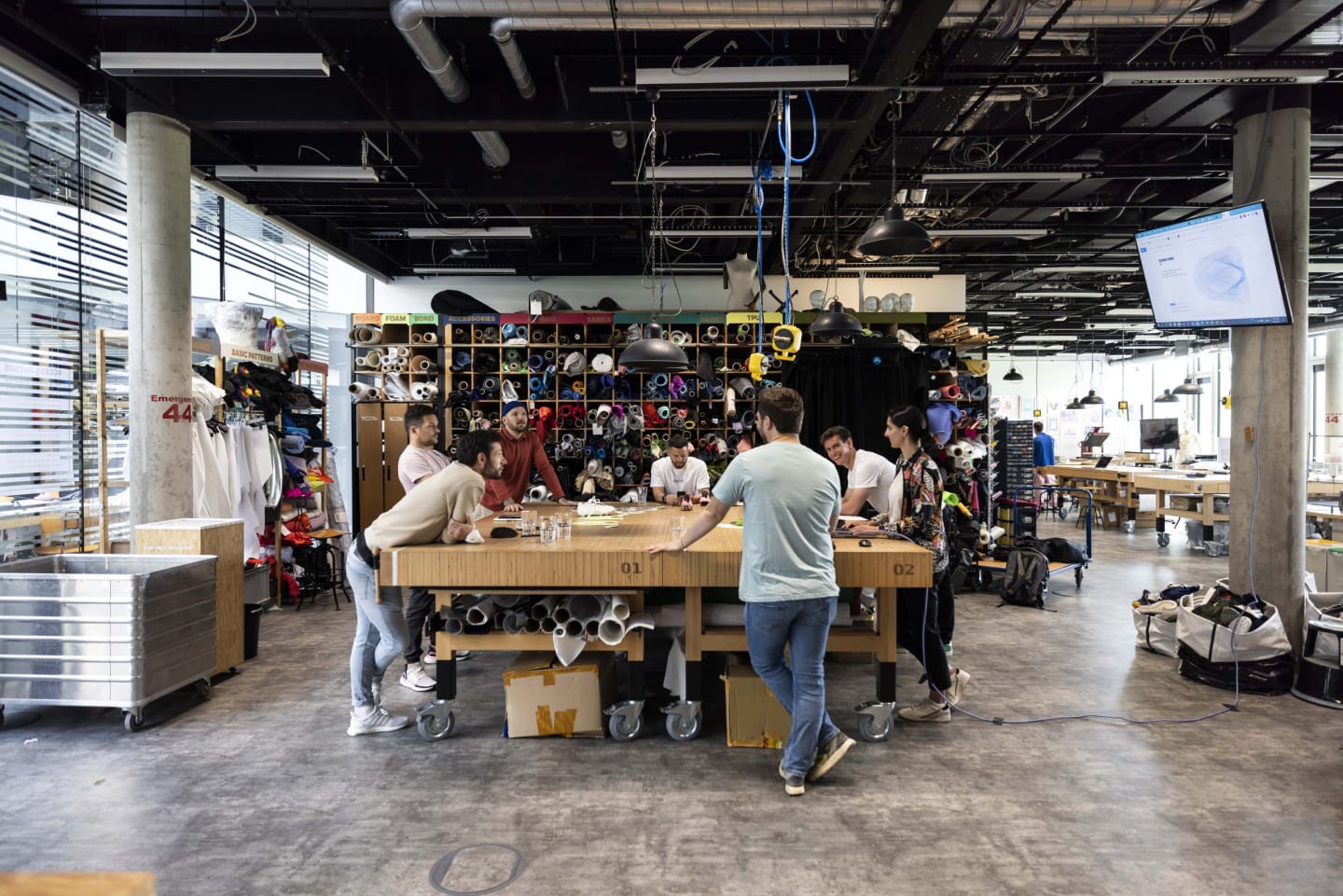People gathered around a table discussing something