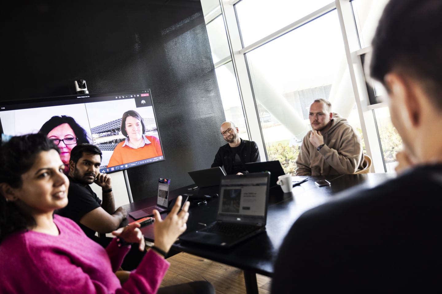 People sitting in a business meeting.