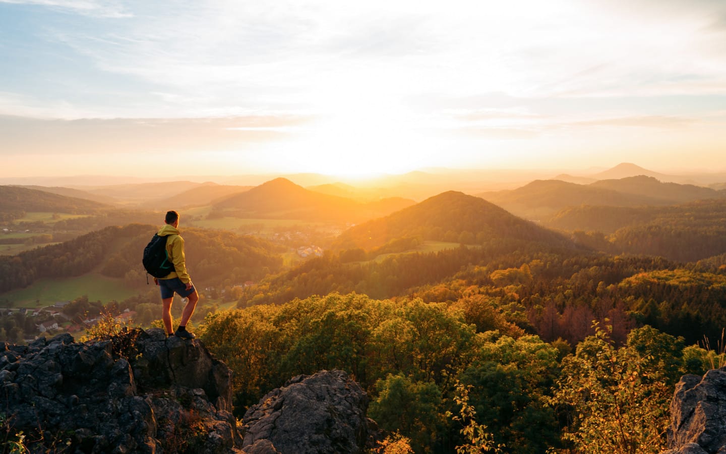 Man standing on top of the mountains