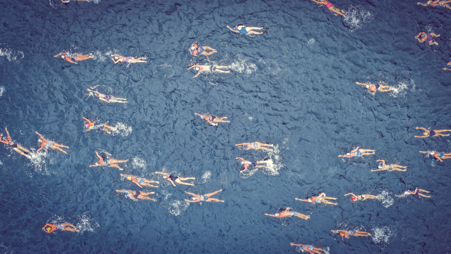people swimming in the open ocean