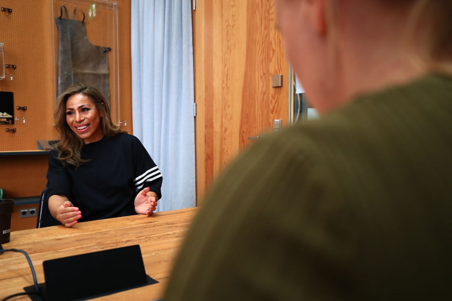 Woman smiling during an interview at adidas