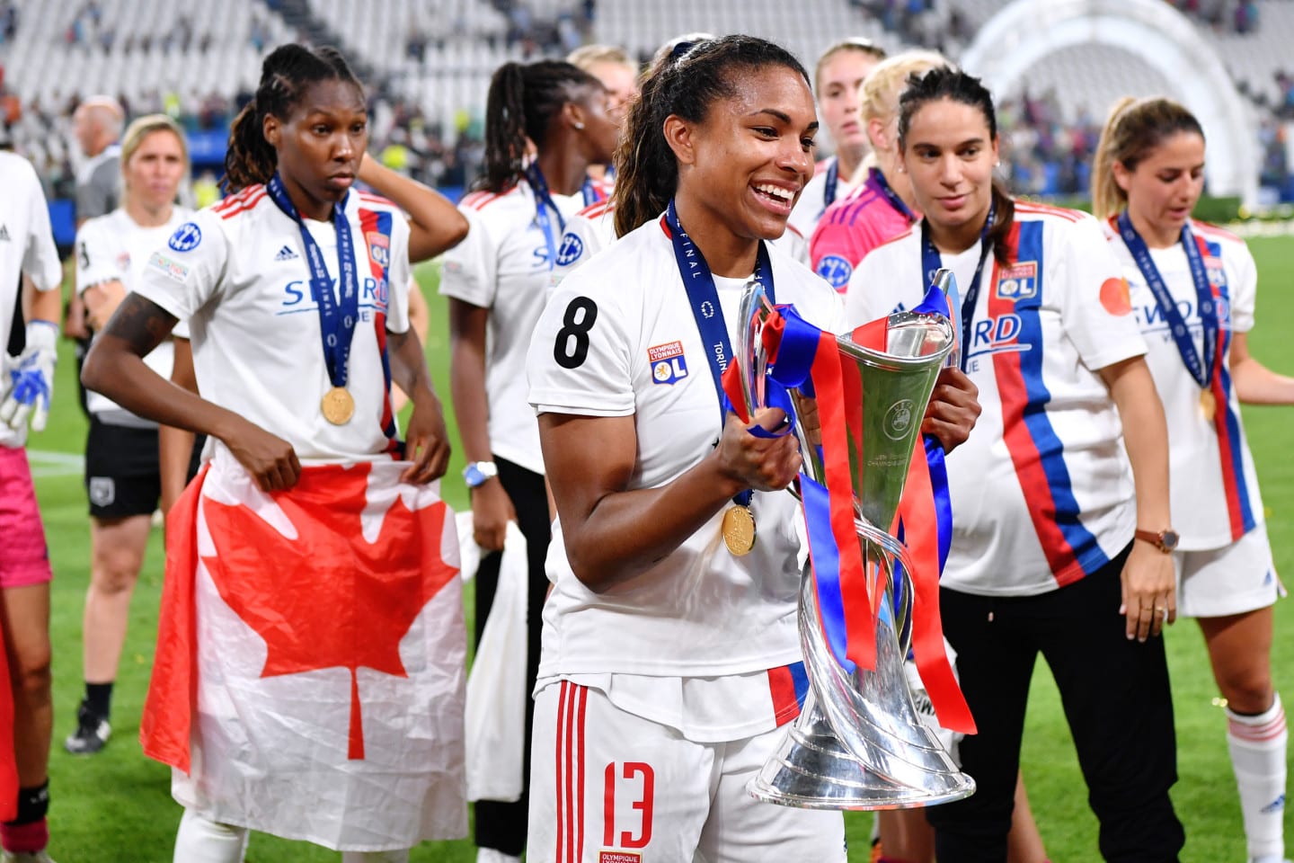 Catarina Macario of Olympique Lyonnais celebrates with the UEFA Women's Champions League trophy wearing adidas