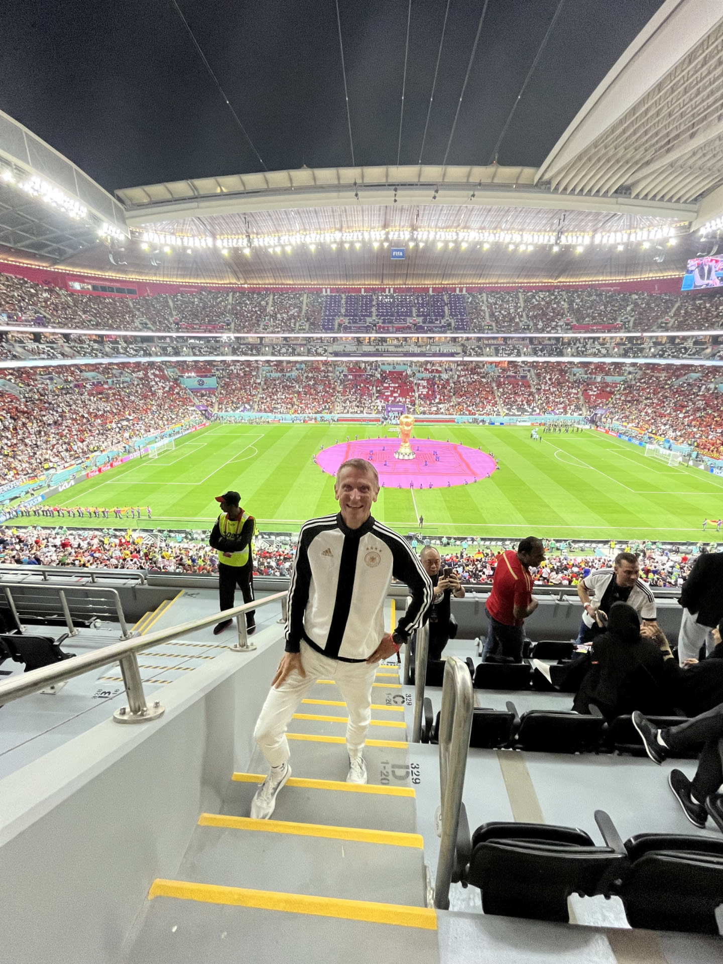Jan stands in front of a football pitch at the World Cup .