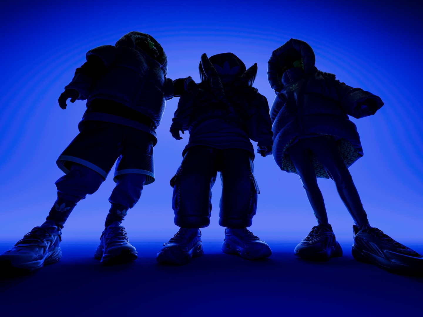 Three people wearing the adidas Ozworld collection in a dark blue room.