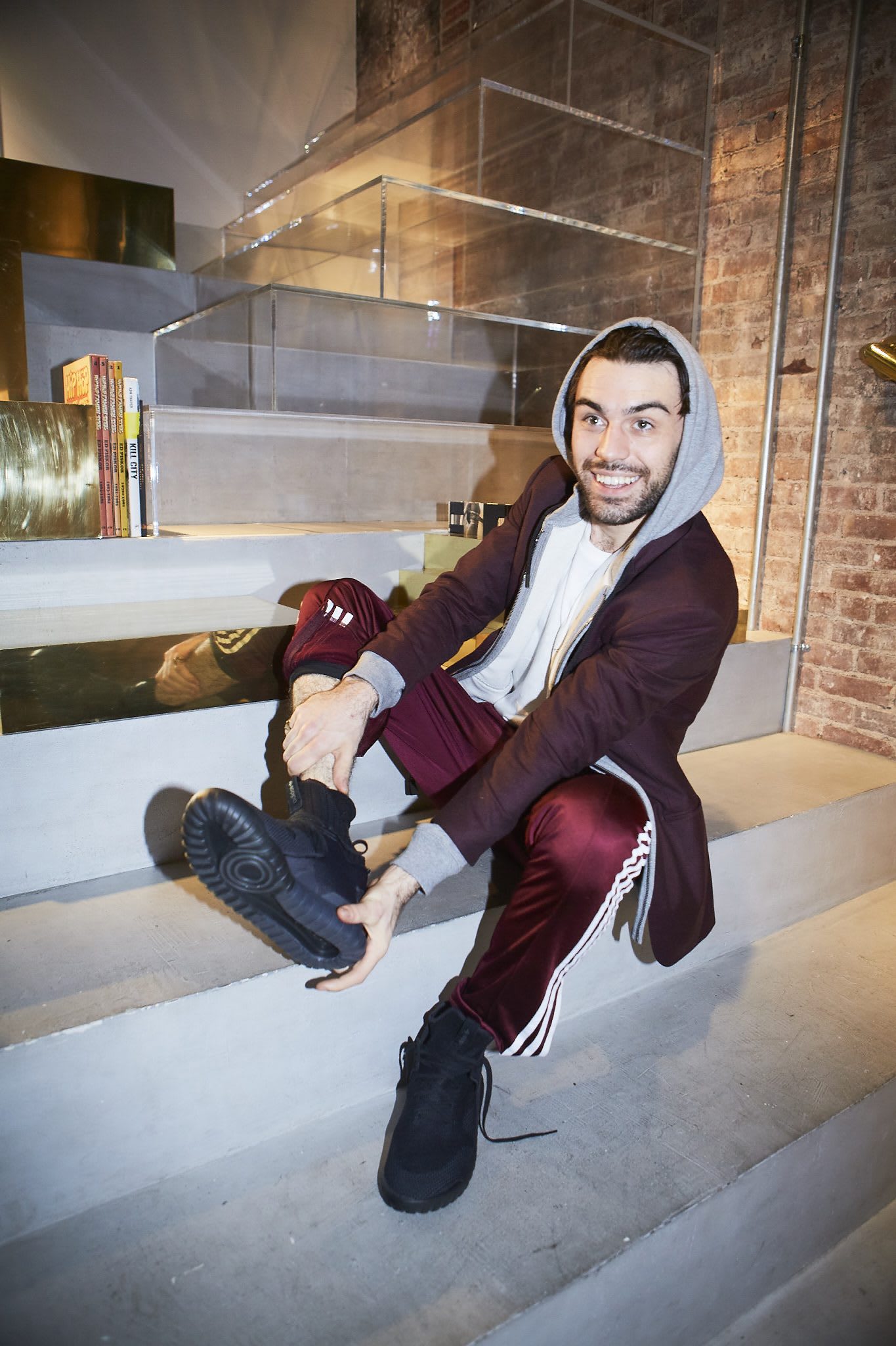 man showing his shoe creators in NYC