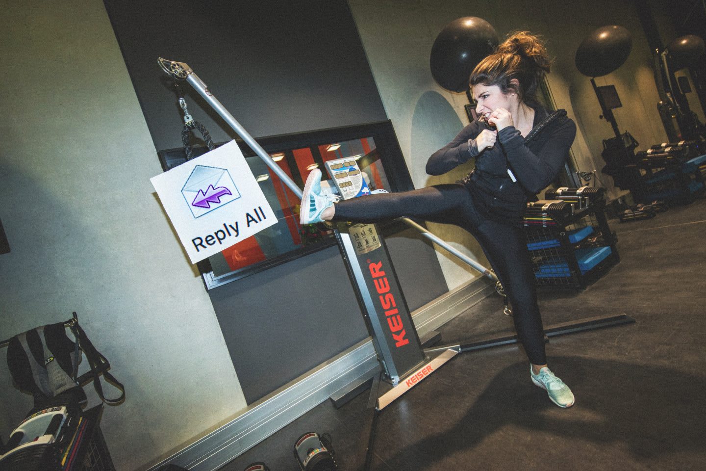 woman kicking against reply all sign stop email madness detox inbox