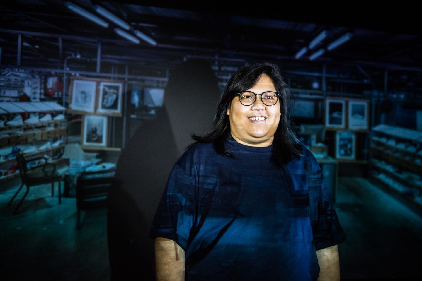 Woman smiling with projection behind her