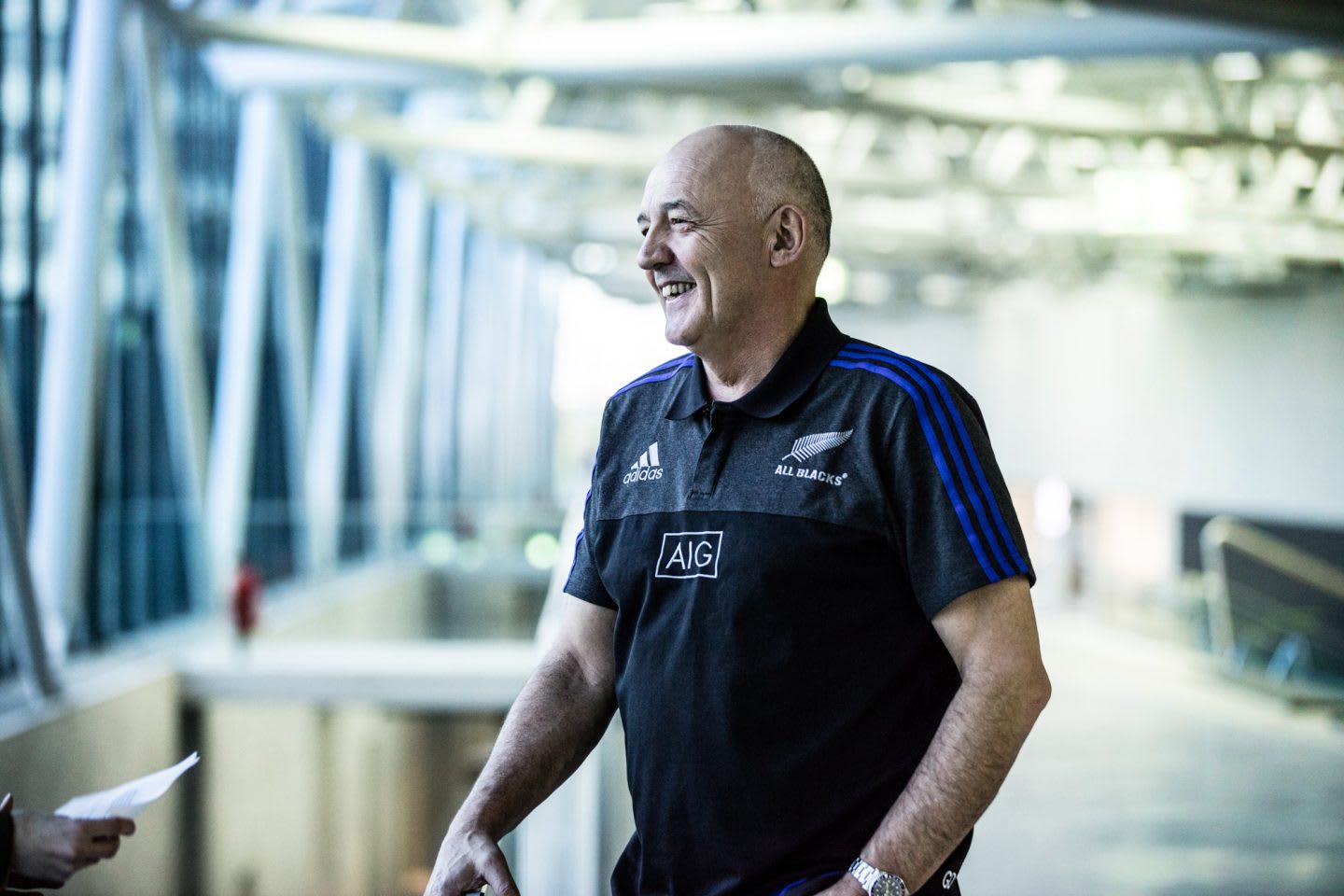 Man laughing during Interview All Blacks Mental Coach Gilbert Enoka talking mental strength vulnerability team spirit