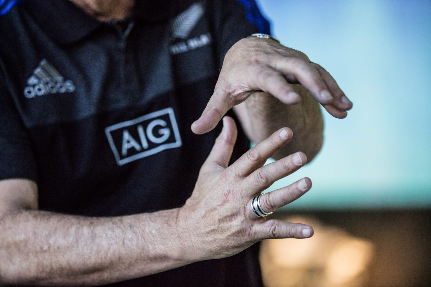 Hands with ring gesturing All Blacks Mental Coach Gilbert Enoka talking Mental Strength Vulnerability Team Spirit