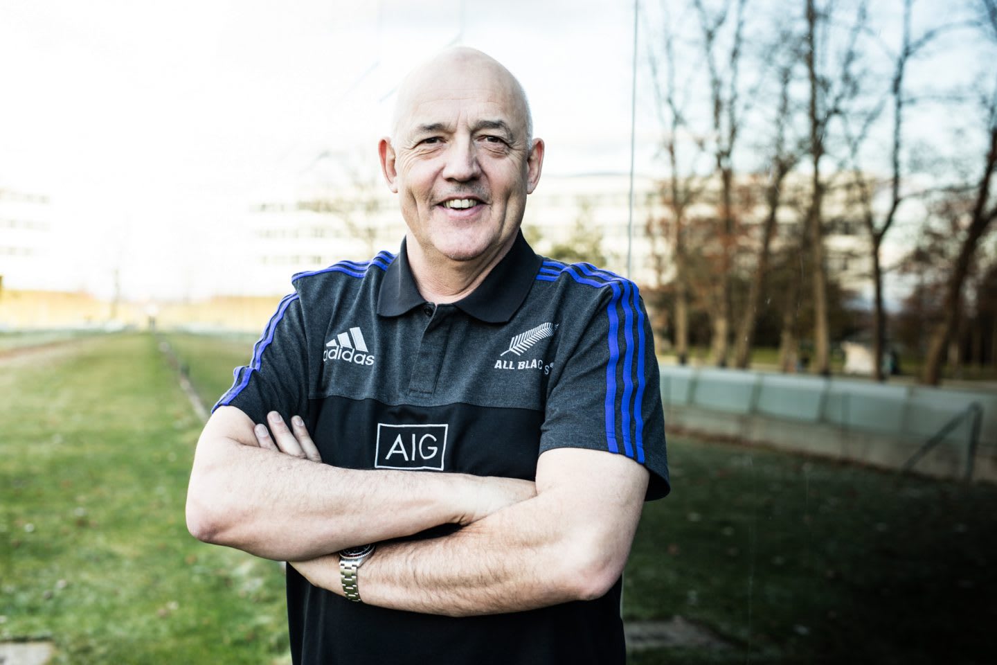 Man standing outside arms folded All Blacks Mental Coach Gilbert Enoka talking Mental Strength Vulnerability Team Spirit
