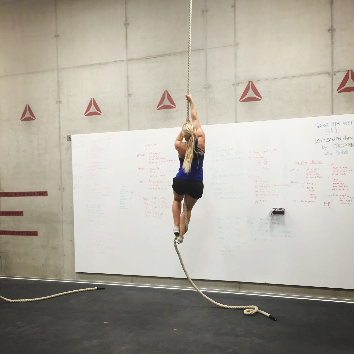 CrossFit girl climbing rope in CrossFit box tough fitness self-confidence letter to my haters
