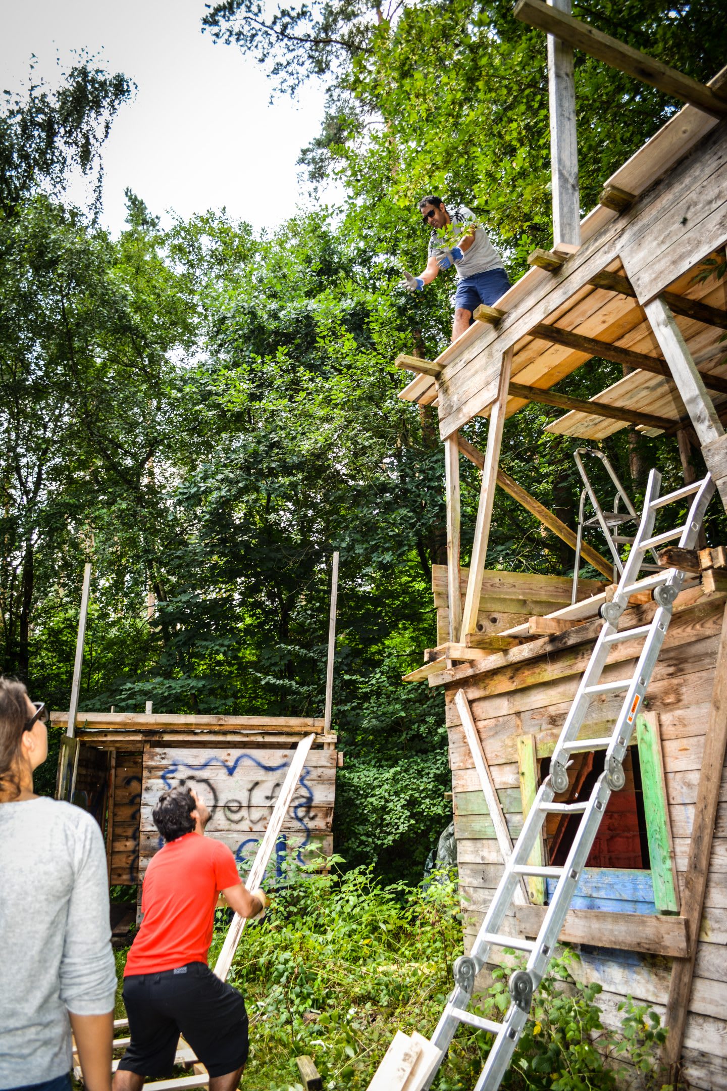 two guys working on a treehouse