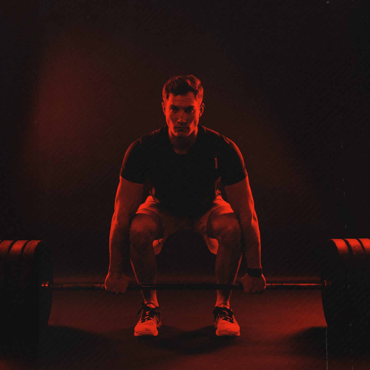 crossfitter focused weightlifting starting position red filter