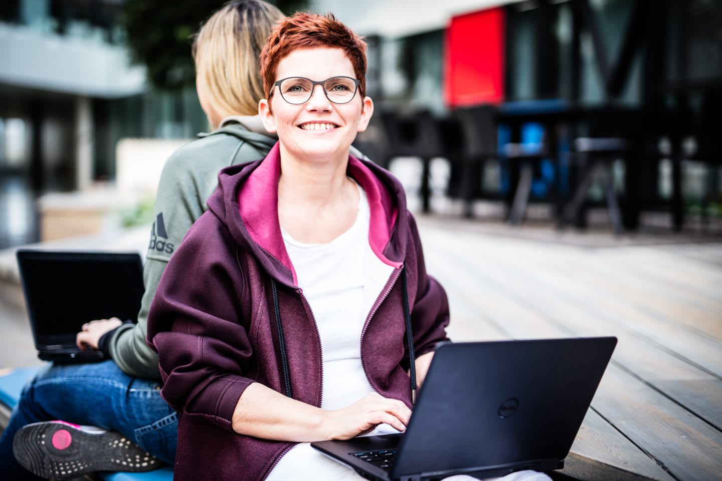 Woman with Laptop smiling Job Sharing at its best interview adidas