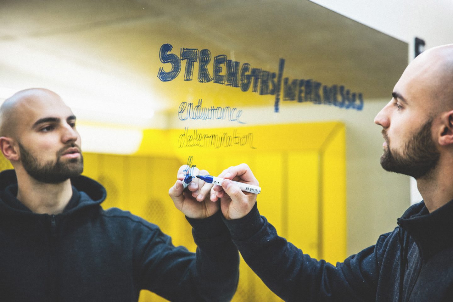 man writing down something on a mirror in a locker room how to finally do what you love