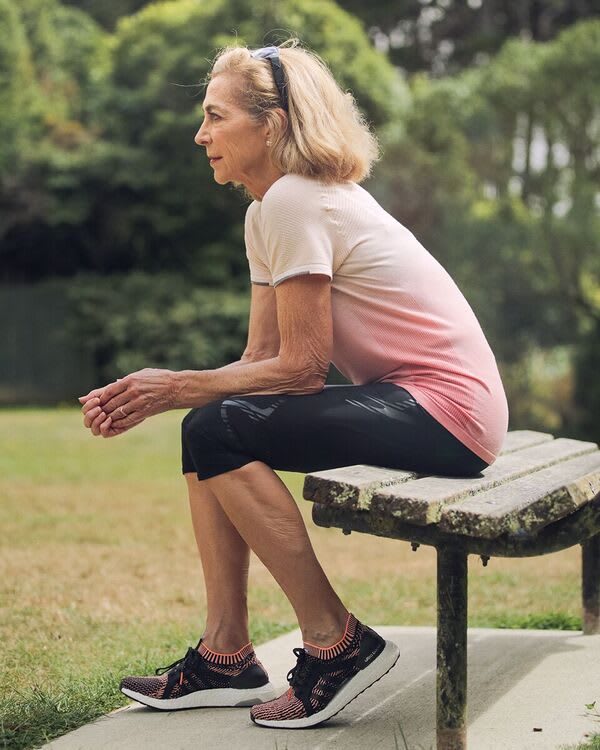Kathrine Switzer sitting in adidas clothes