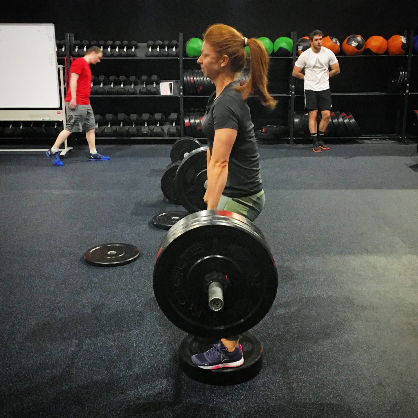 woman lifting weights in the gym friday night workout