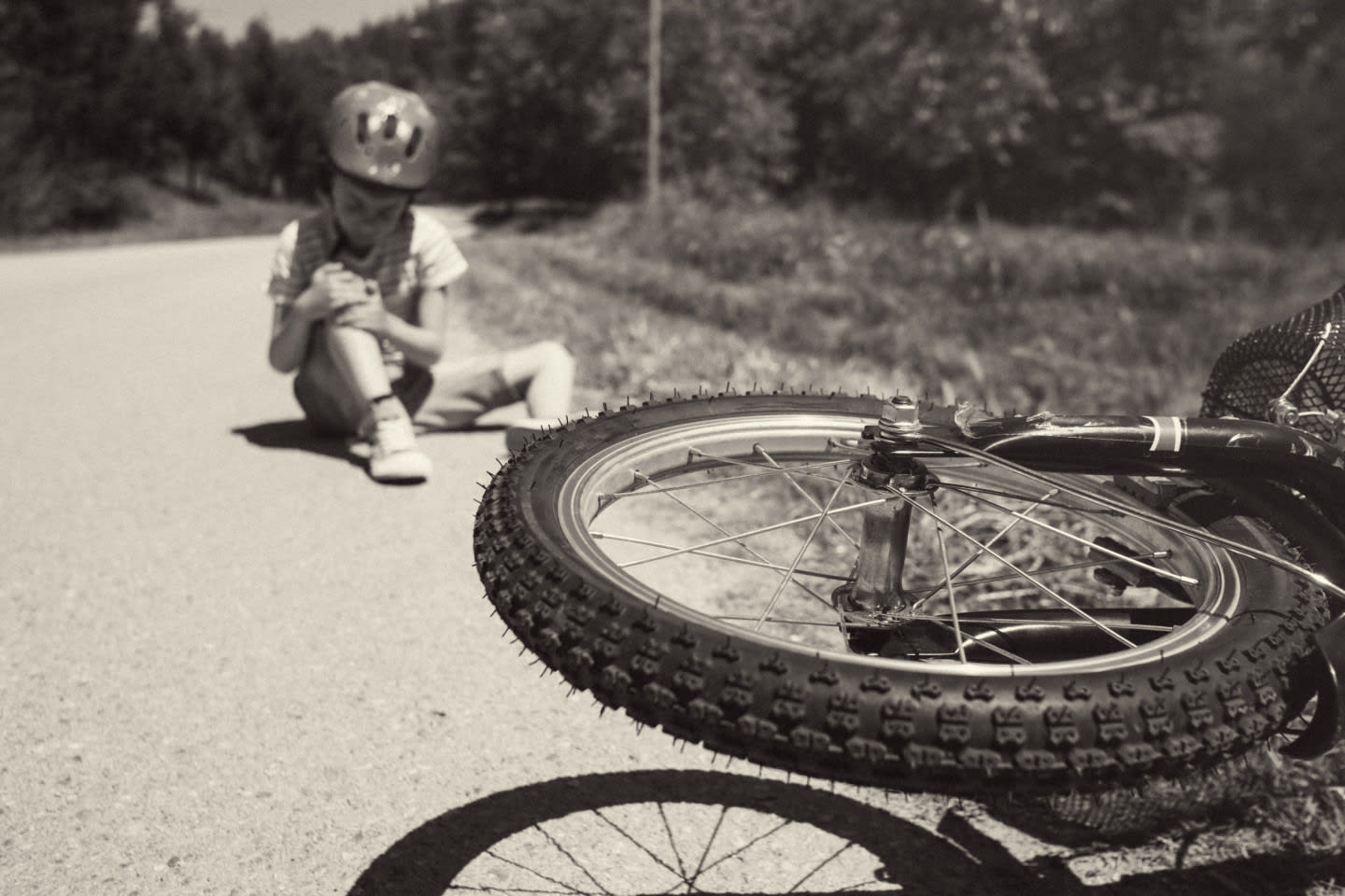 Boy lying hurt after a bicycle accident success failure
