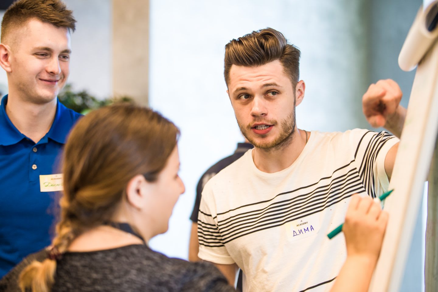 keep-your-emotional-health-in-shape-adidas-Russia-employee-pointing-at-flipchart