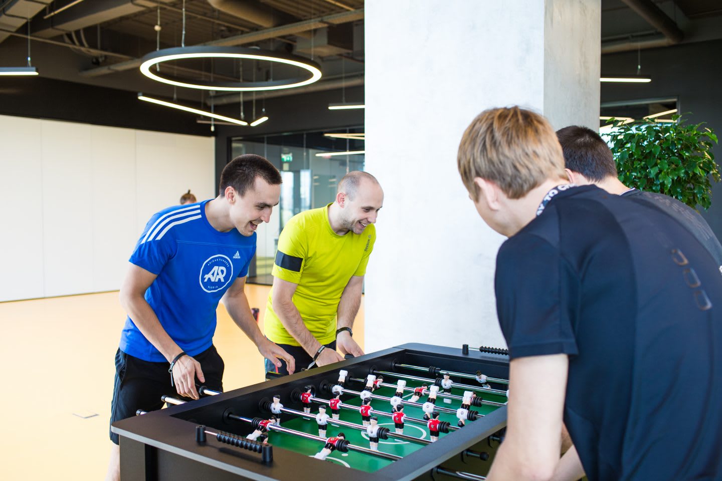 keep-your-emotional-health-in-shape-adidas-Russia-employees-bonding-playing-table-soccer