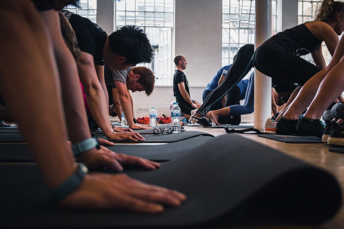 people working out in gym class room, pilates, yoga, fitness, networking, sweatworking