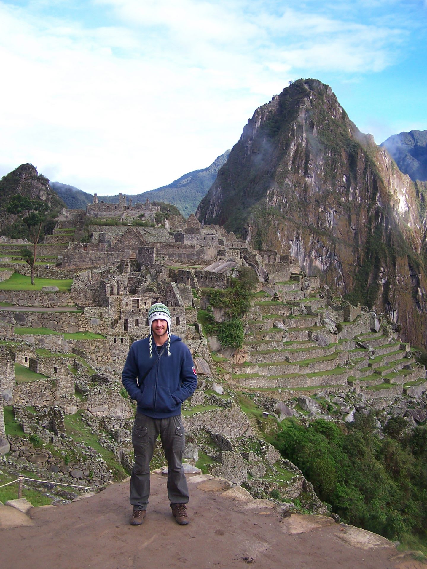 Tourist standing in front of Machu Picchu