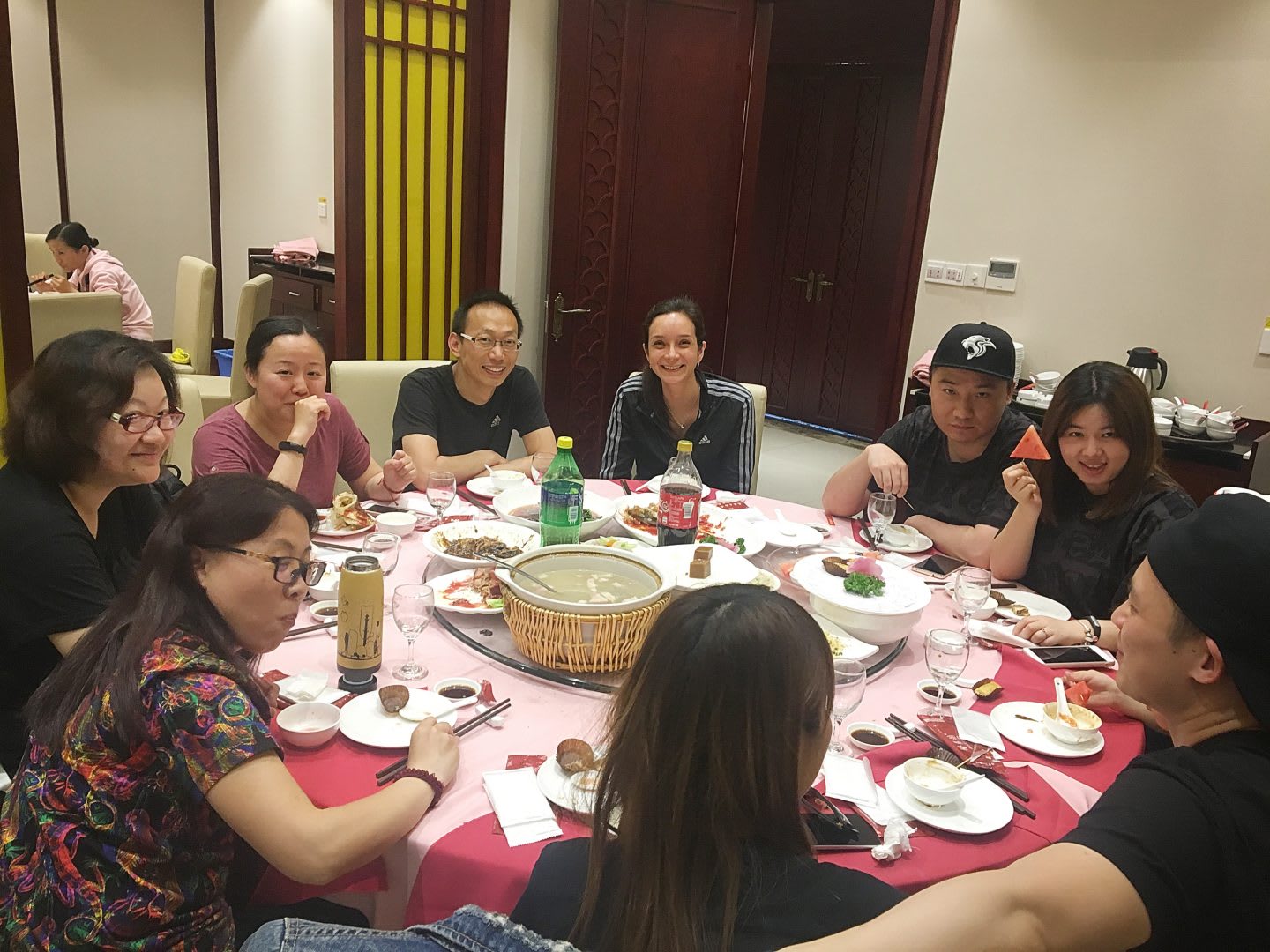 team sitting on table having dinner trainee shanghai experience