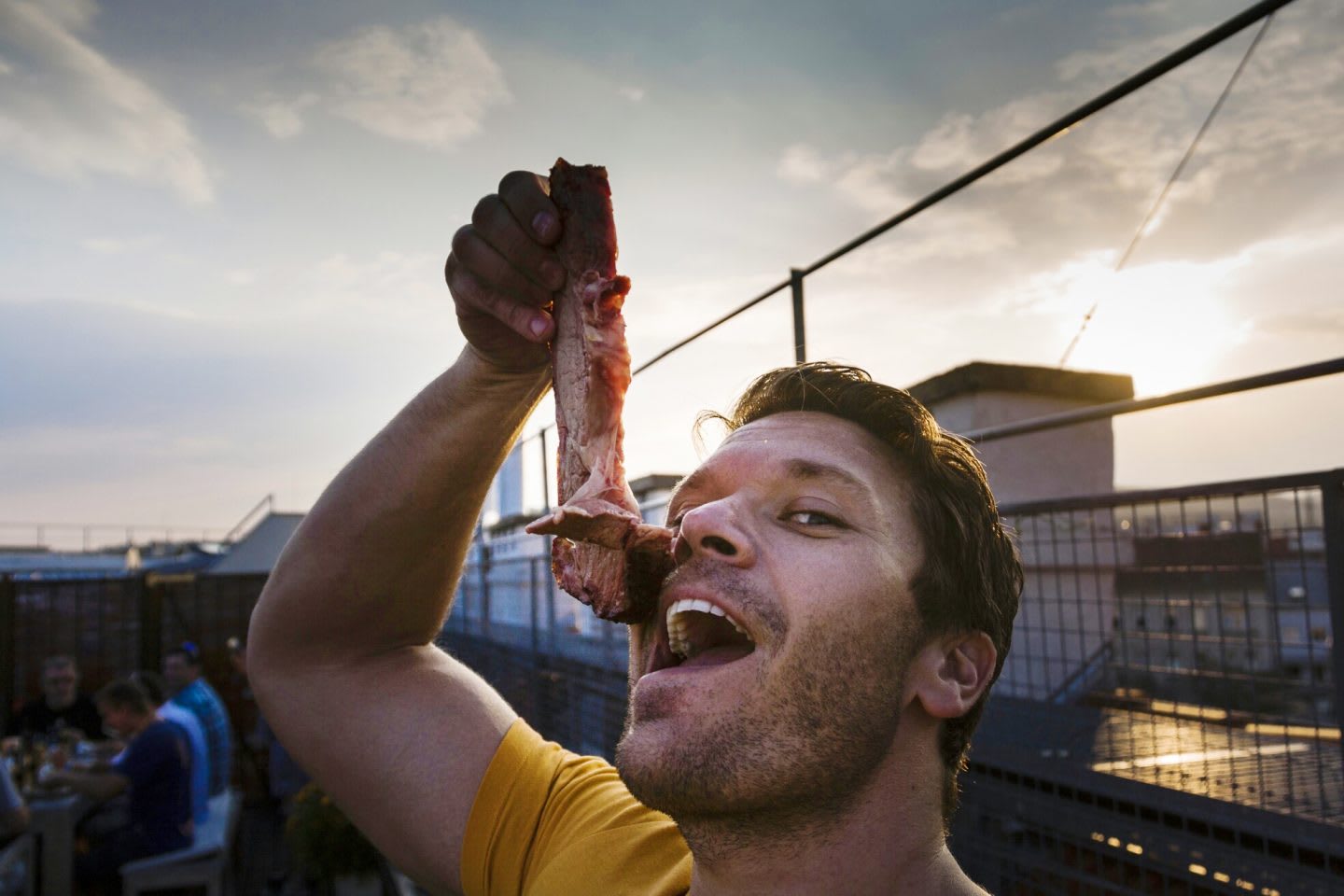 Funny man holding a piece of raw meat on mouth, adidas, GamePlan A, nutrition, health, clean eating, paleo, fitness