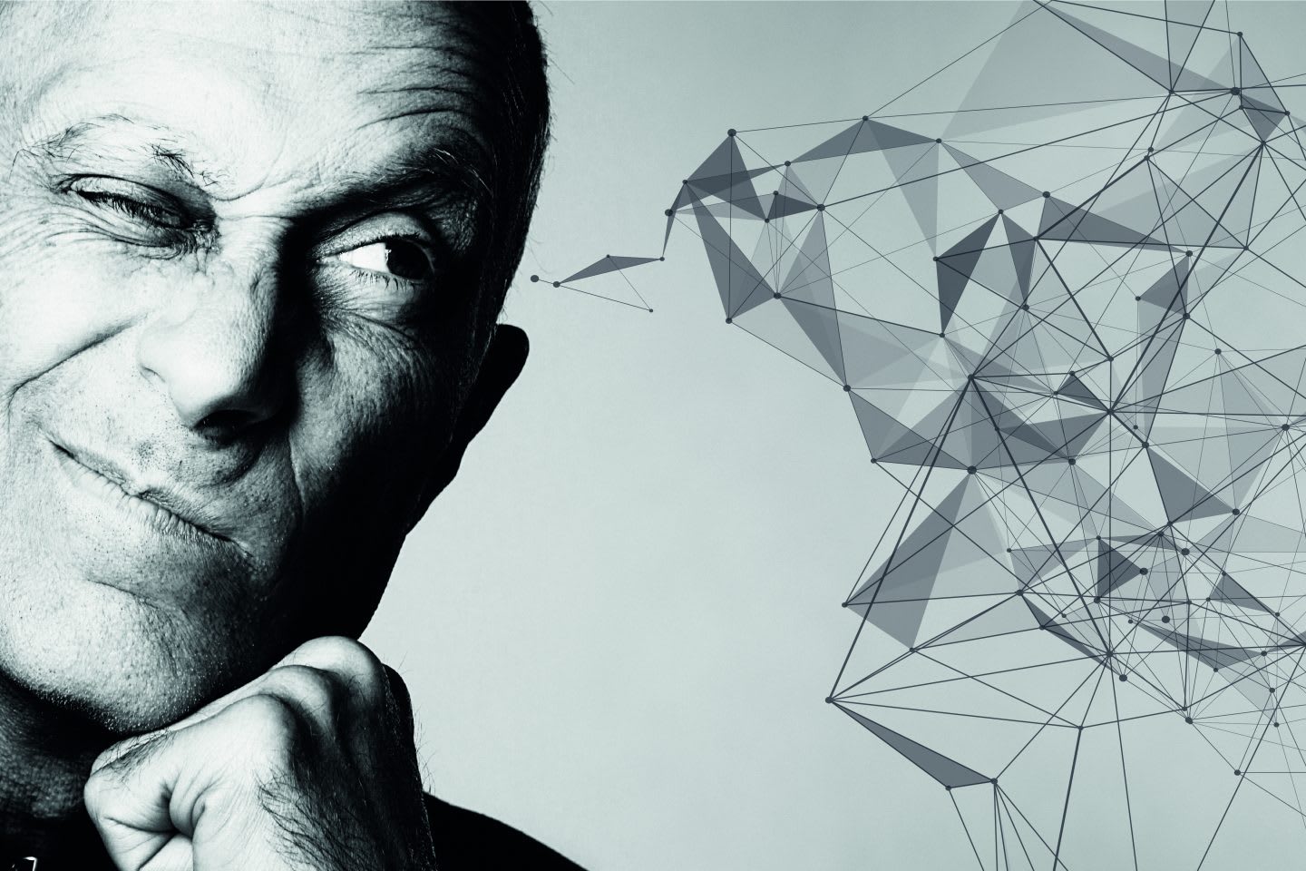 Black and white image of man with one eye closed focused and thinking with an abstract doodle drawn to illustrate his creative thoughts.