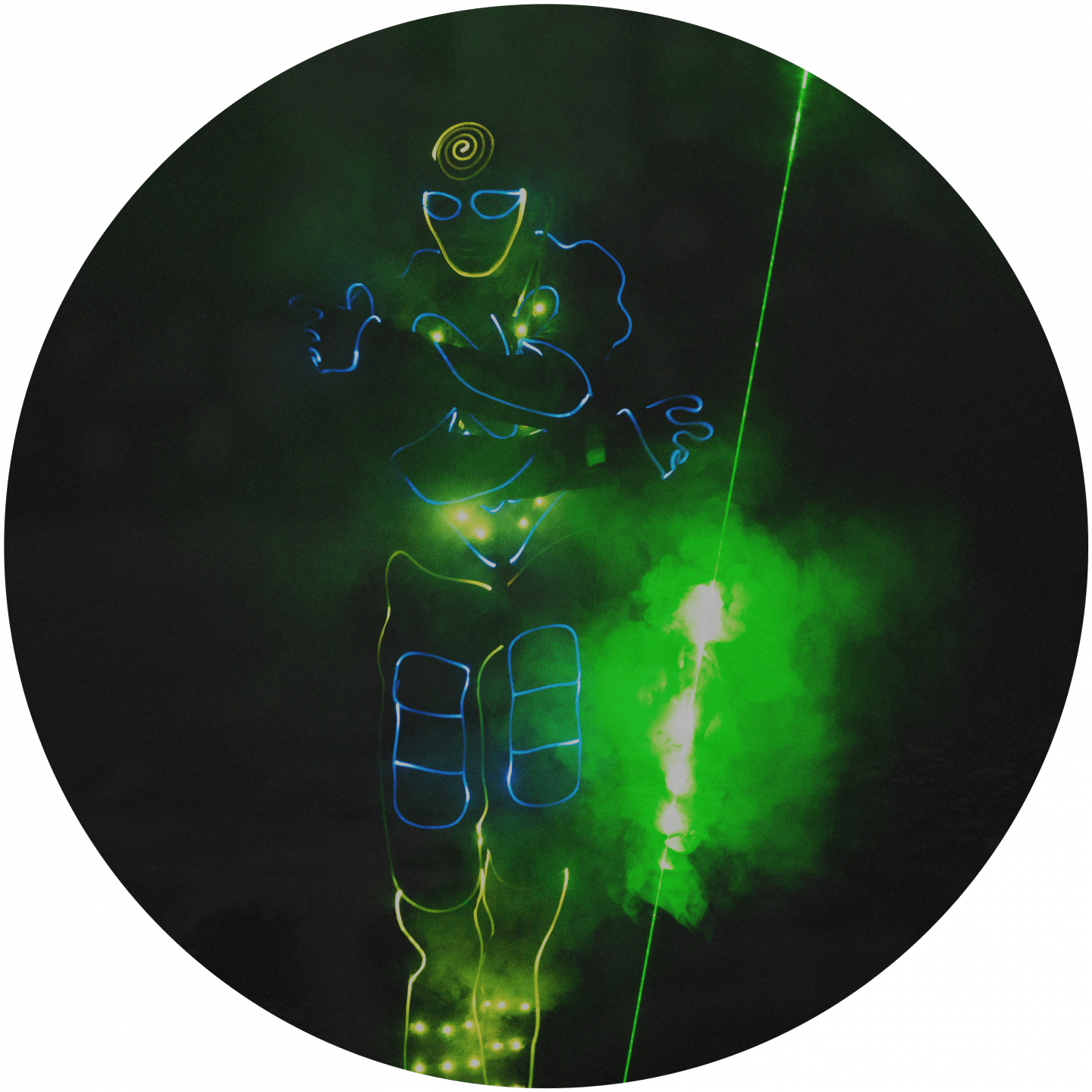 A man wearing neon lights moving through the dark with a green laser. team building, lasertag, light, neon, team, event, business, adidas, GamePlan A