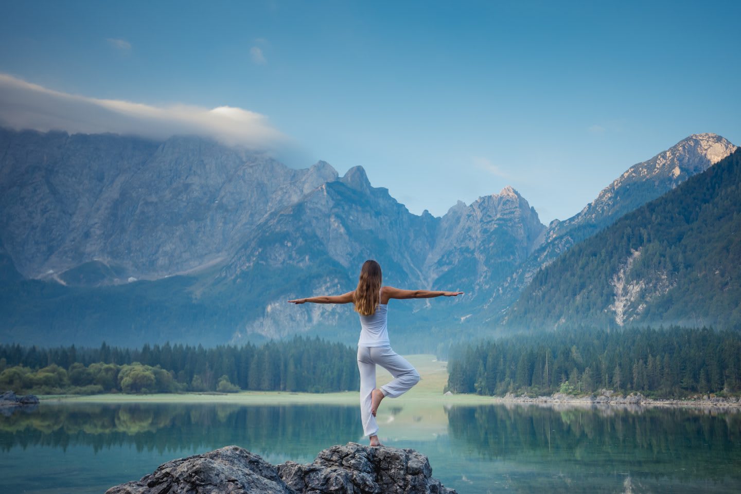 Young beautiful woman doing yoga exercises. Healthy lifestyle concept.