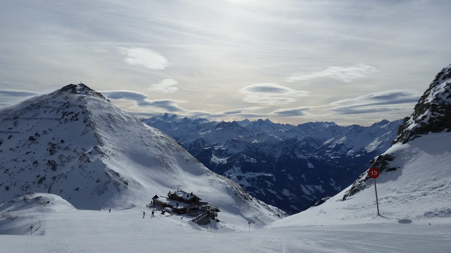 mountain scene in the sun with snow