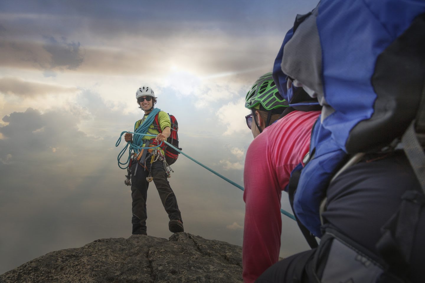 Climber on mountain top holding rope for partner, Mont Blanc, France, adidas, GamePlan A, team building, leadership, diversity, Latin America