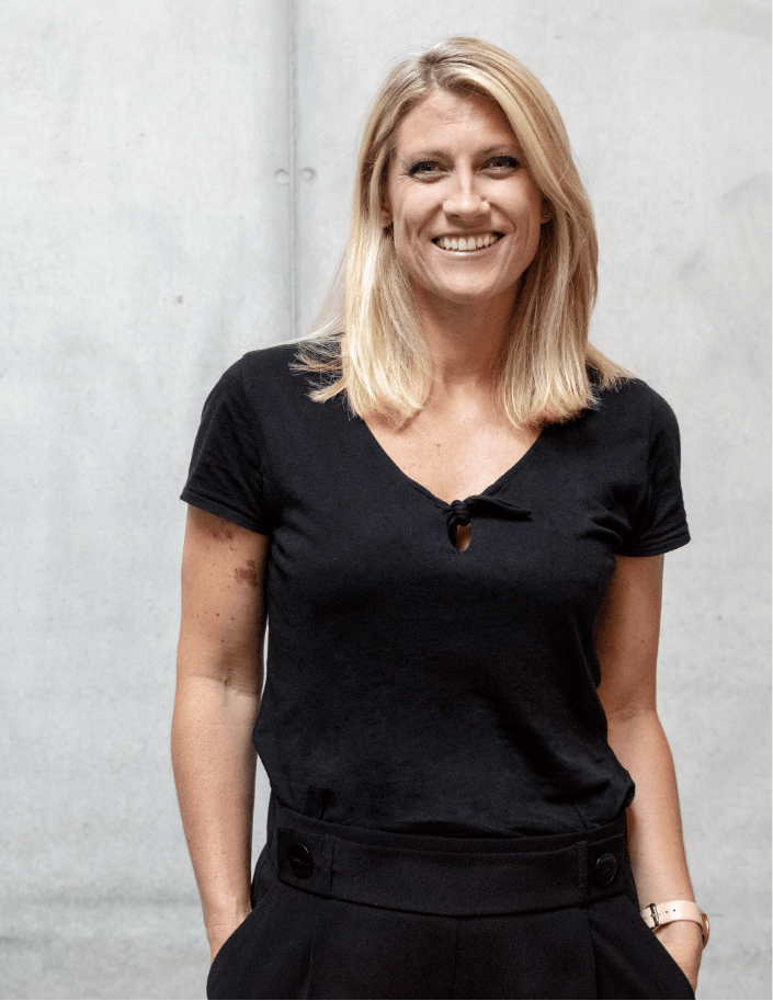 Portrait photo of Kate Woods, Senior Director Running at adidas and former Olympian hockey player.