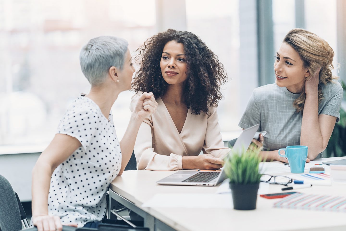 Group of businesswomen talking in the office. Mentoring, women, meeting, diversity, equality