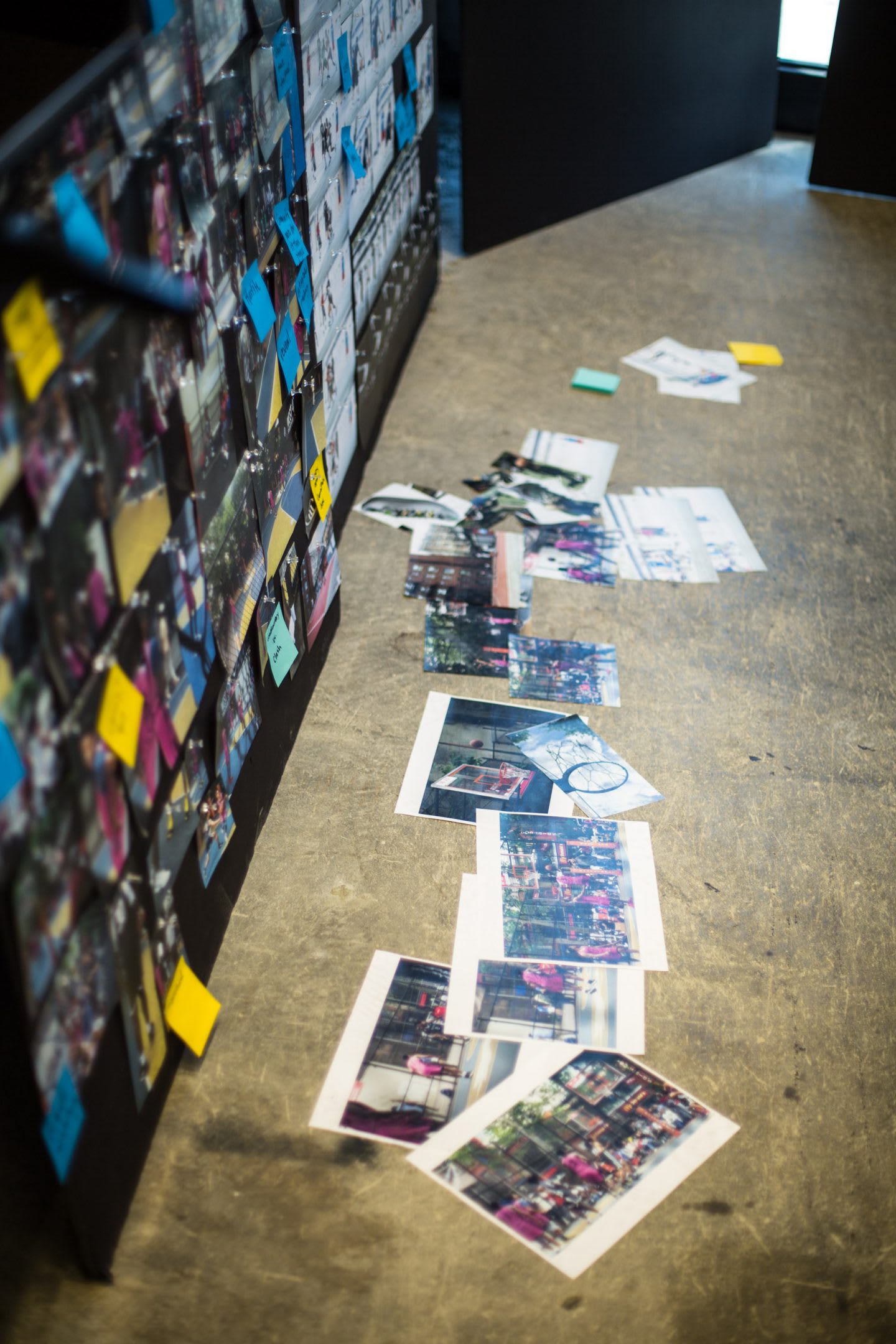 Photos lying on the floor to be sticked to a moodboard, idea generation, inspiration, inspirational photos, creativity, creative space, work space, office space, mood board, Brooklyn Creator Farm, adidas, GamePlan A