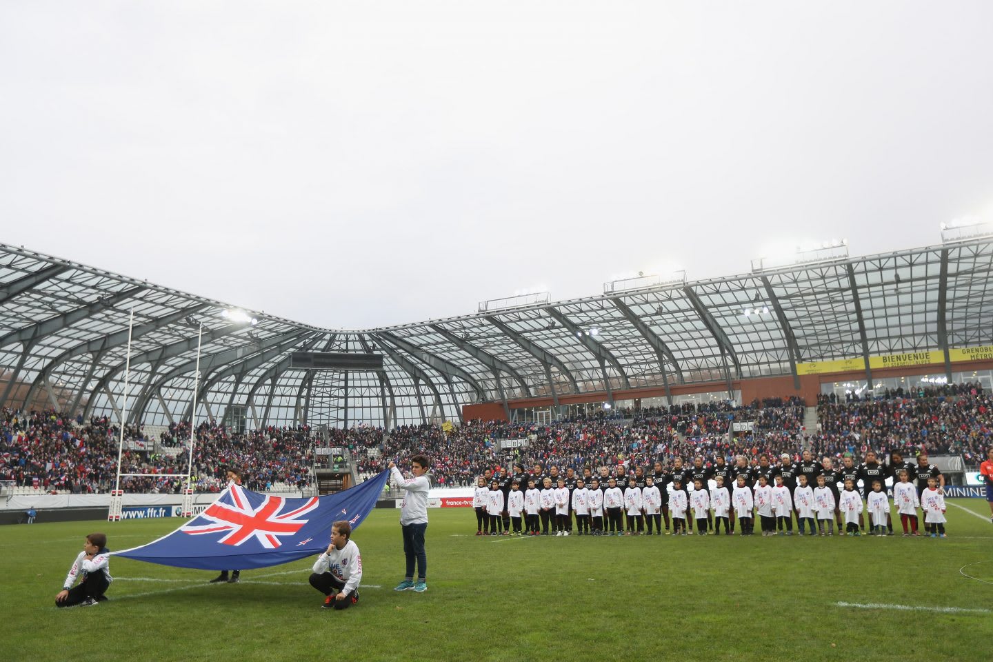 GRENOBLE, FRANCE - NOVEMBER 17: The Black Ferns stand for their National Anthem during the Womens International match between France Women and the Black Ferns at the Stade des Alpes on November 17, 2018 in Grenoble, France. | women's rugby
