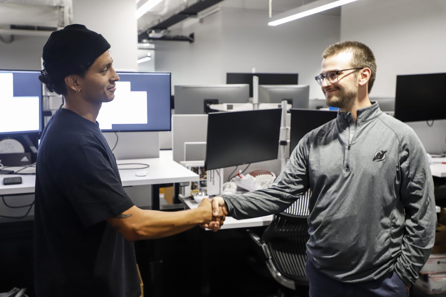Two men shaking hands in the office at adidas. team, success, work, GamePlan A