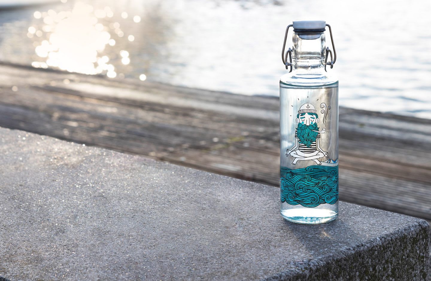 Soulbottle with sailor graphic on the sea front.