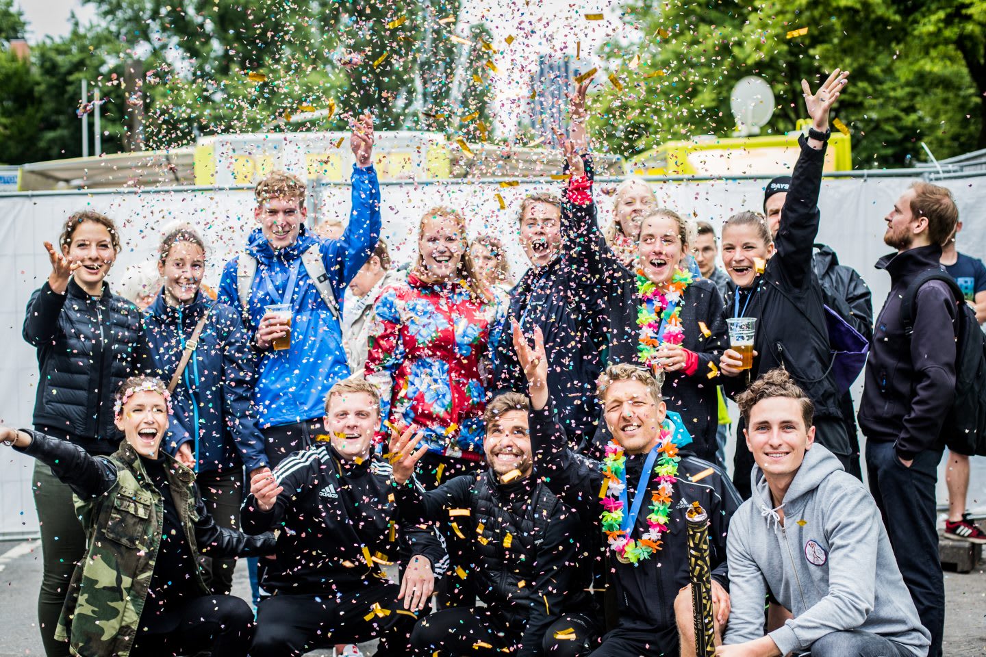 Group photo with people throwing confetti in the air. How to build a creative workplace culture, JvM, workplace, workplace culture, creativity, GamePlan A