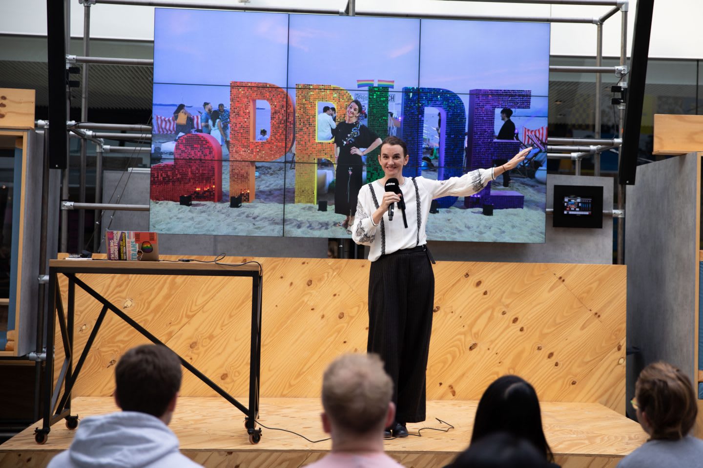 Tea Uglow presenting with a screen behind her saying