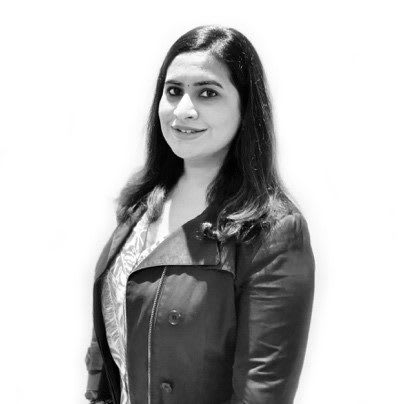 Woman wearing dark jacket smiling at camera, Ishaani, Nathoo, adidas, employee