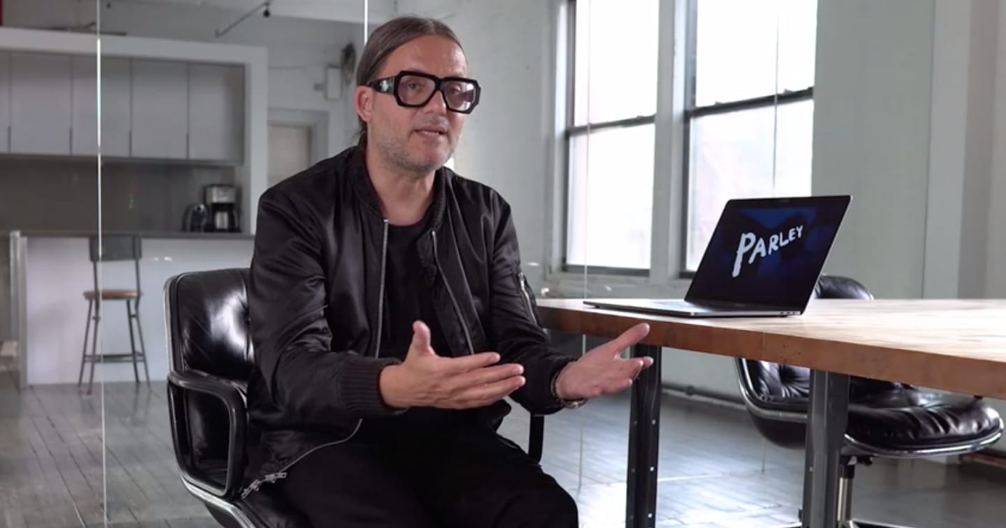 Man with black framed glasses explaining an idea, Cyrill Gutsch, founder, CEO, Parley for the Oceans, sustainability, plastic waste, innovation