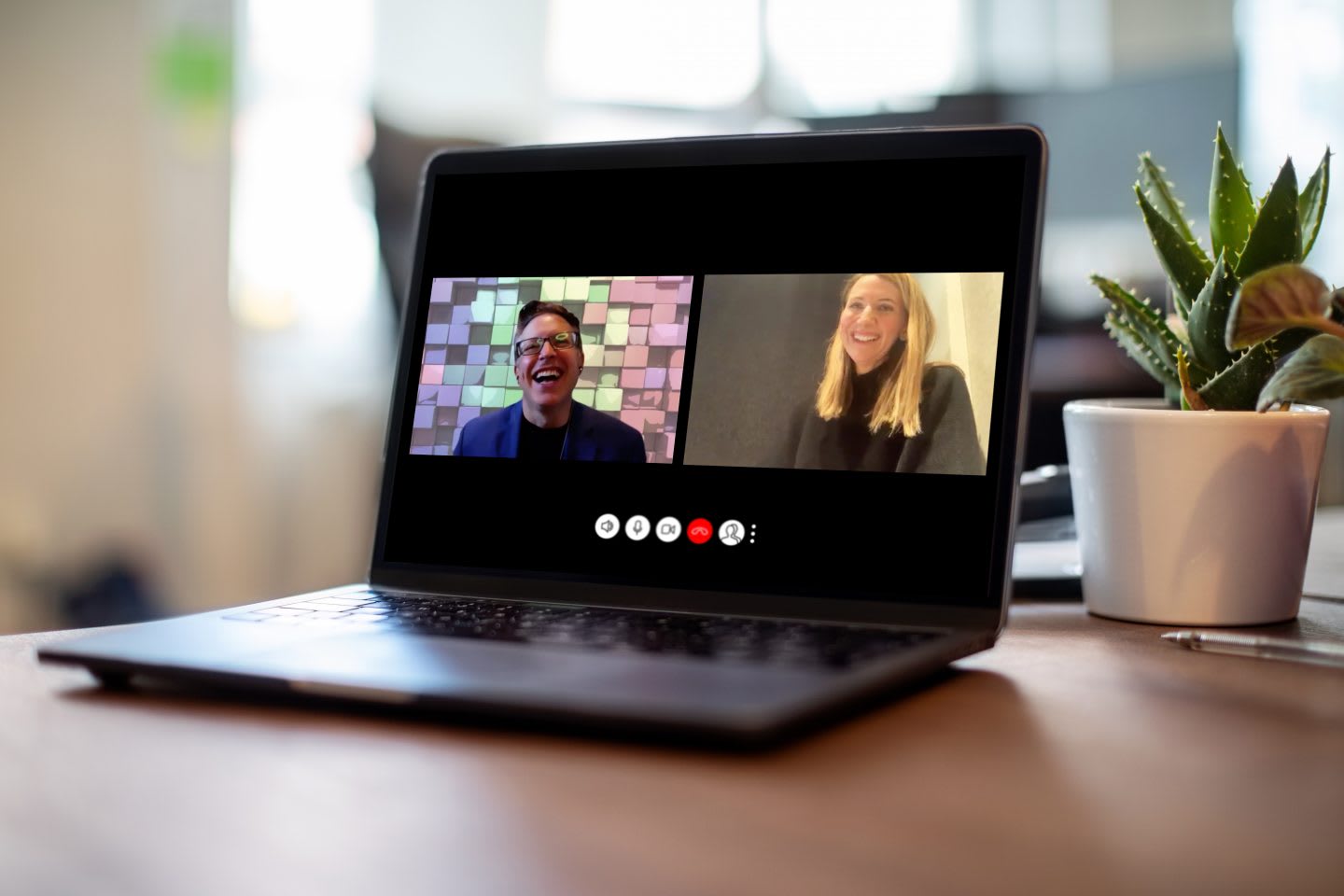 Man and woman having a video call on a laptoWoman having meeting on video call on laptop, connection, technology, meeting, collaboration, teamwork, Aimee Arana, Ronald Beghetto, adidas, LEGO
