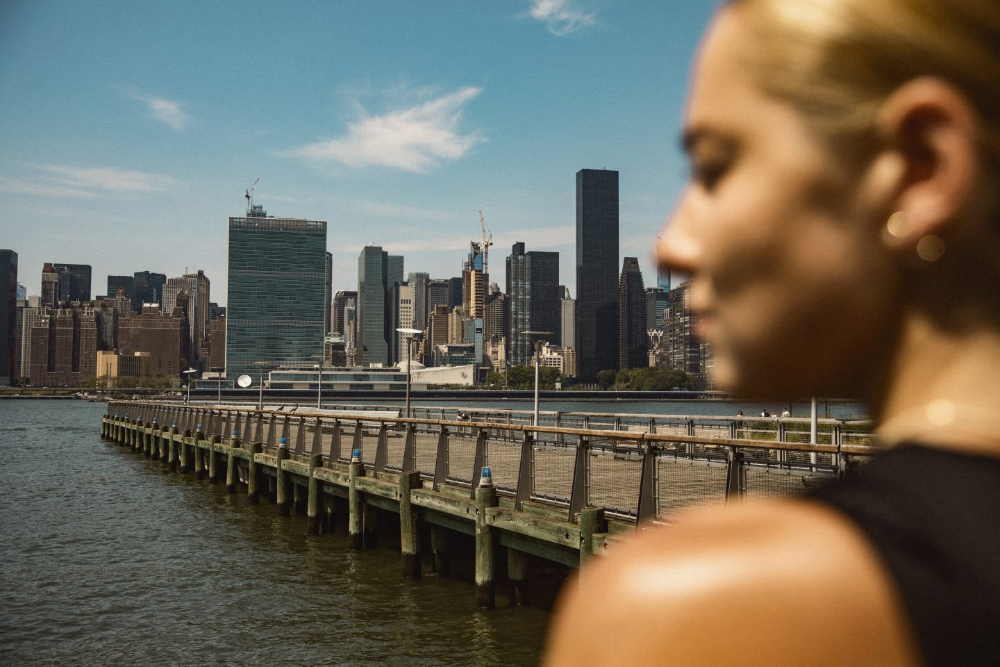 Woman staring out at city skyline, view, city, buildings, metropolitan, adidas, sports, GamePlan A