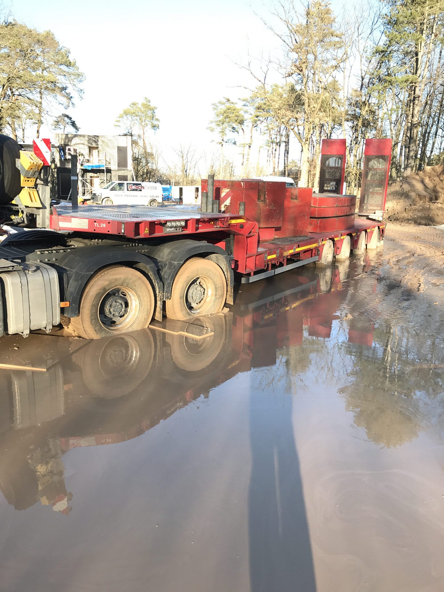 A carrier on the construction site of the basecamp for the German national football team at adidas headquarters standing in the mud. Home Ground, football, Germany, adidas headquarters, teamwork, GamePlan A.