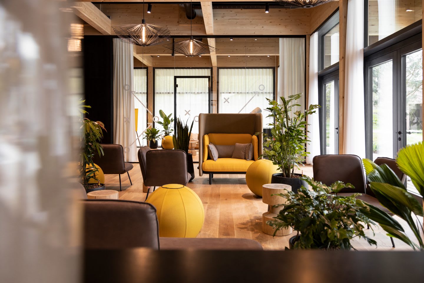 An indoor team area with lounge furniture and focus areas inside the German national football teams base camp. Home Ground, football, teambuilding, adidas headquarters, GamePlan A.