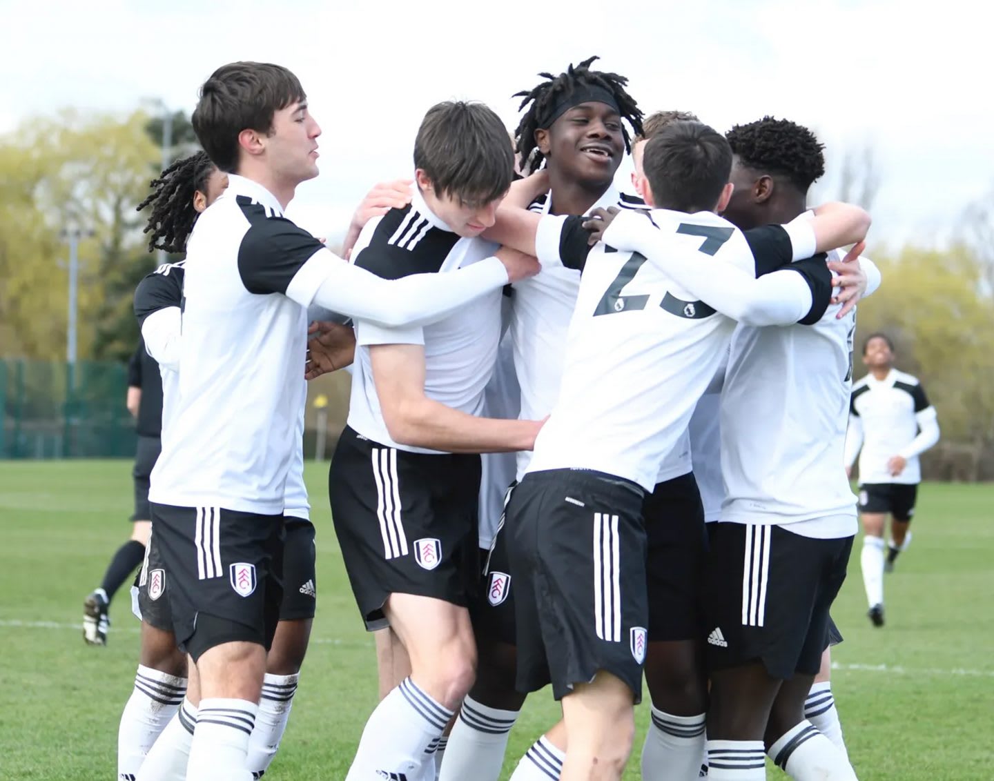 Football team celebrates together. Football, together, inclusion, Fulham FC, giving opportunities